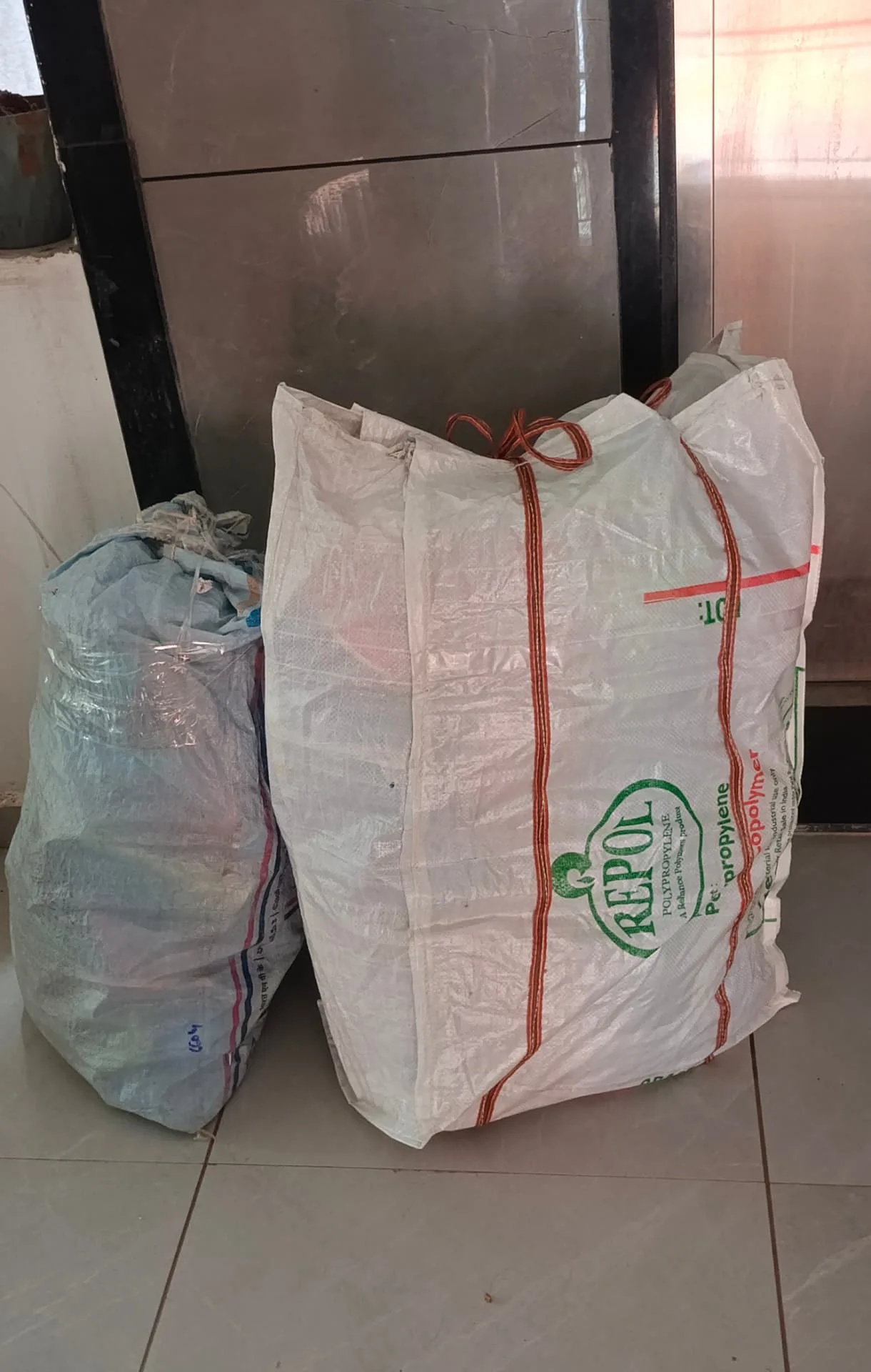 Luggage delivery service Surat — bags and soft goods bundled ready for doorstep pickup