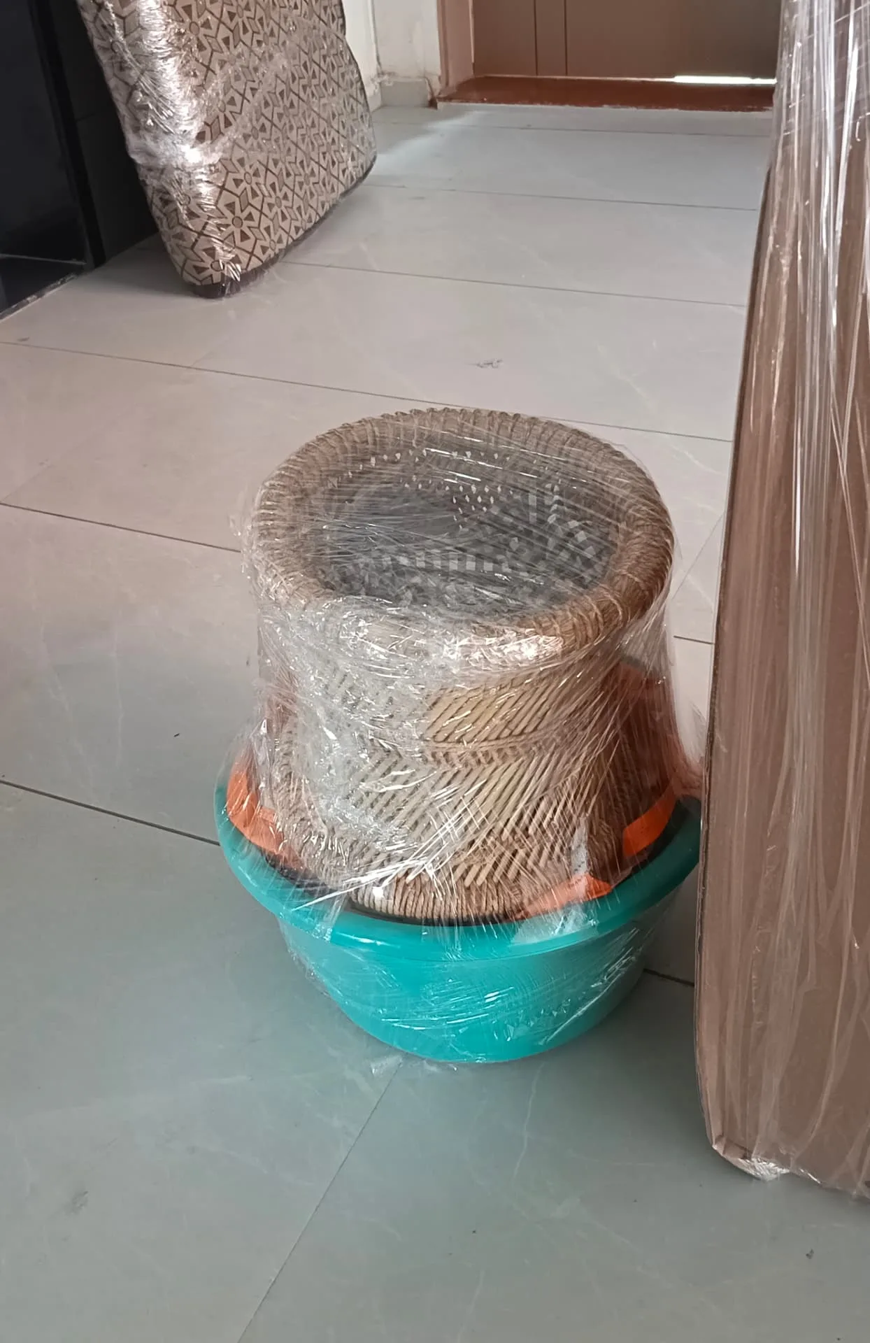 International packers and movers Surat wrapping household items in export-grade packing