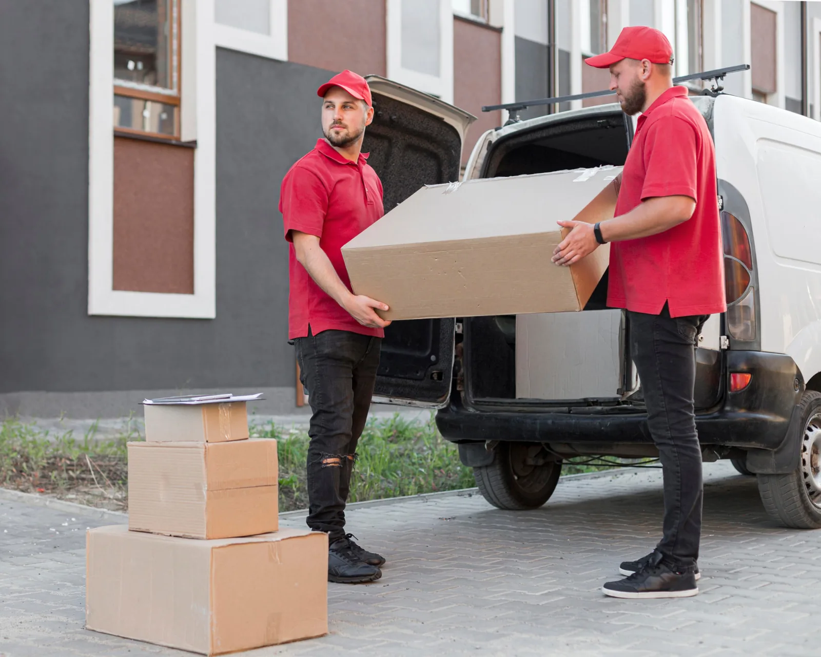 All India packers and movers Surat loading a packed carton into a long-distance moving truck